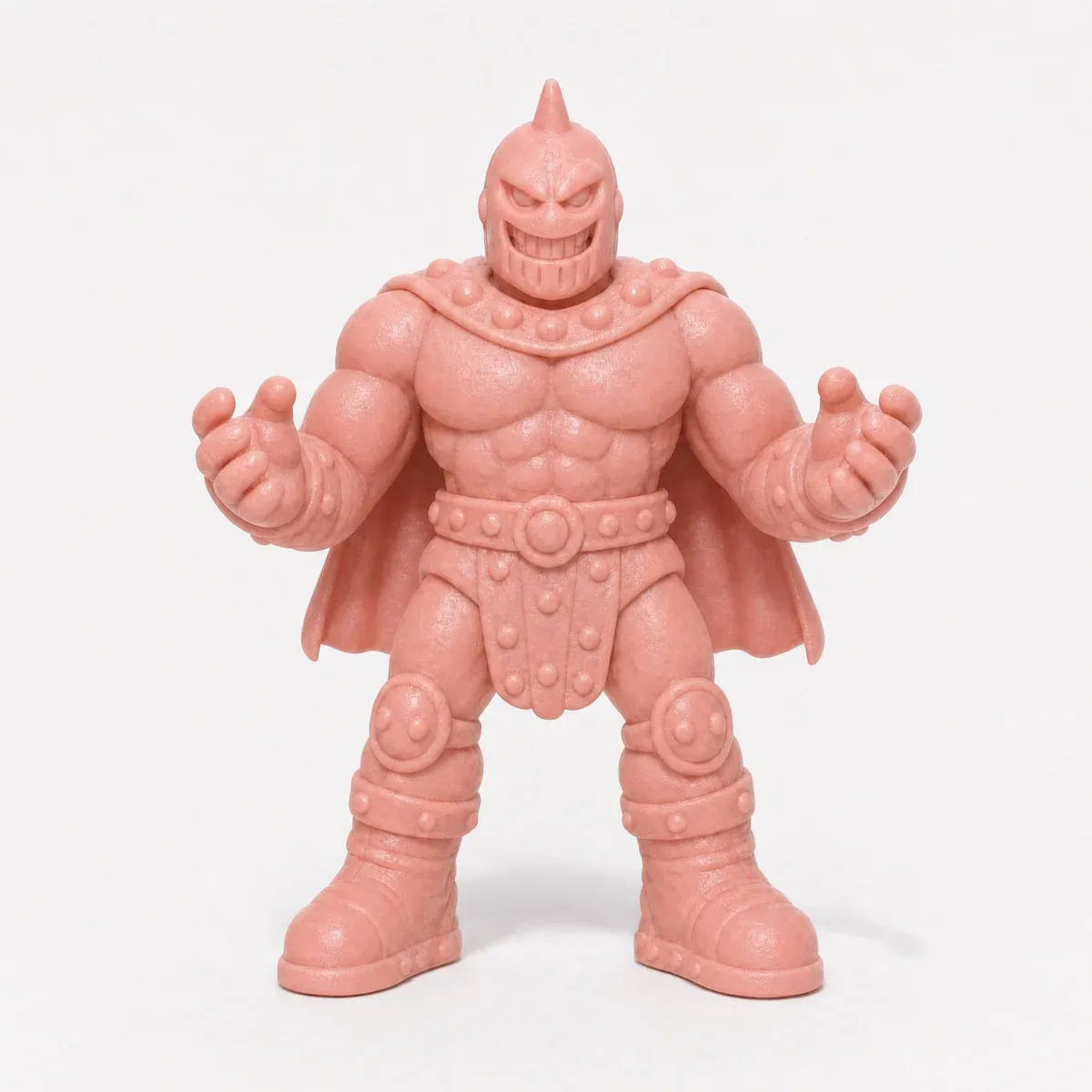 A pink toy figure of a masked wrestler in a short cape, fists clenched.
