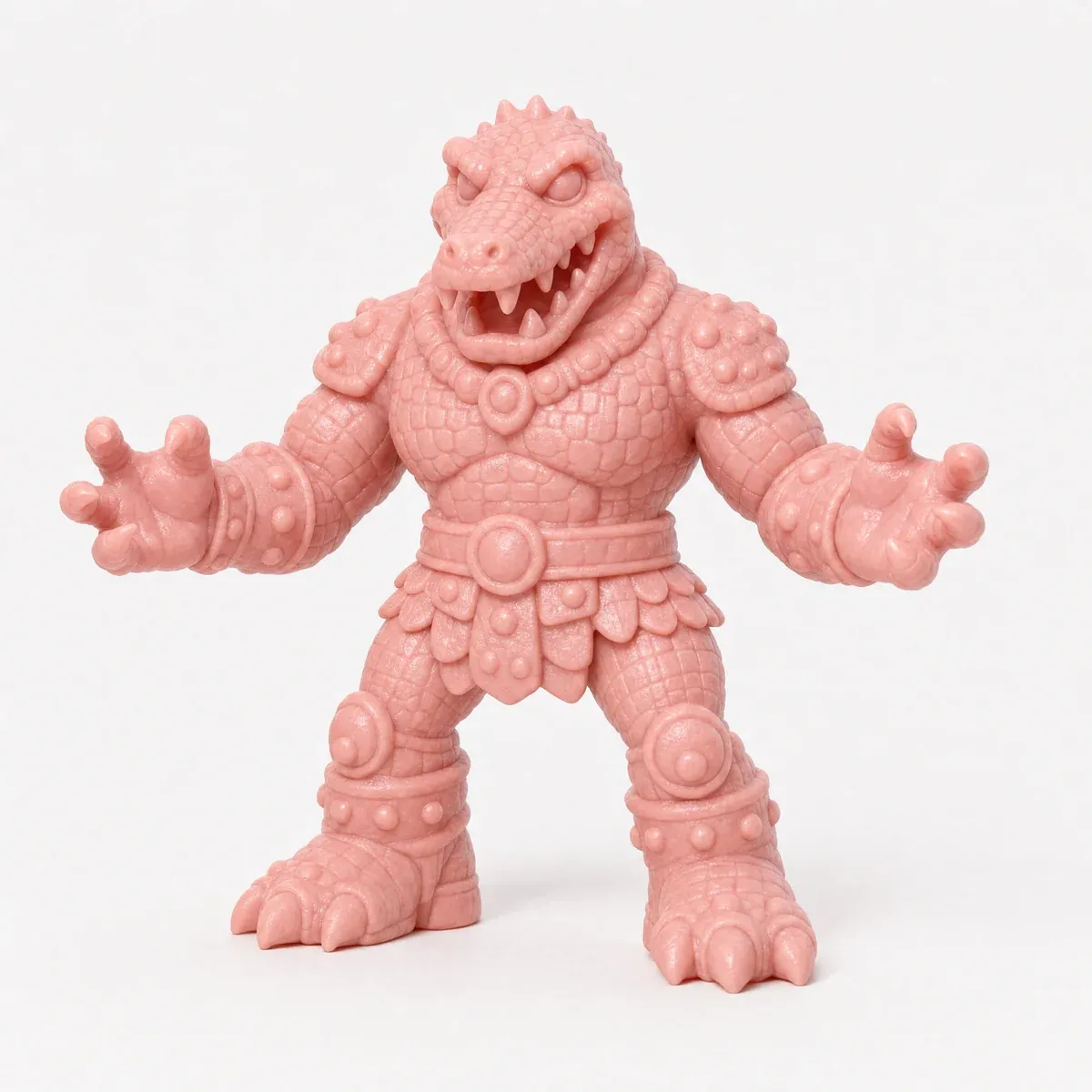 A pink toy figure of a crocodile man with a toothy snout, scales and a belted loincloth.