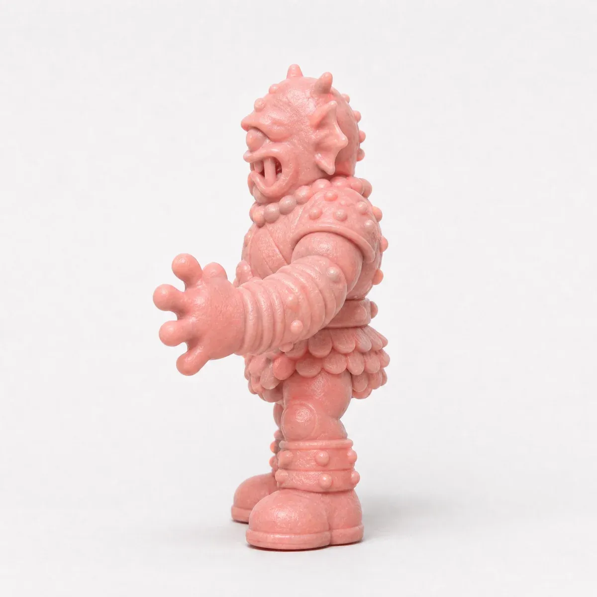 The same cyclops figure in profile.